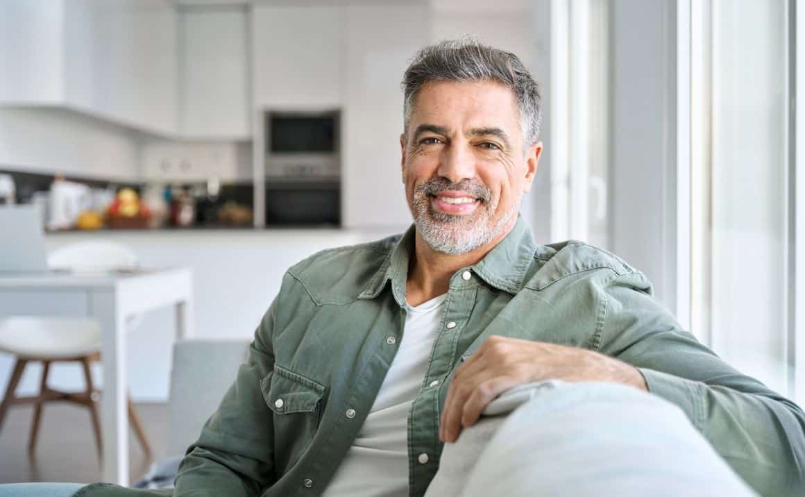 Service page content 4 Smiling man at home, conveying improved well-being, confidence, and quality of life after treatment.